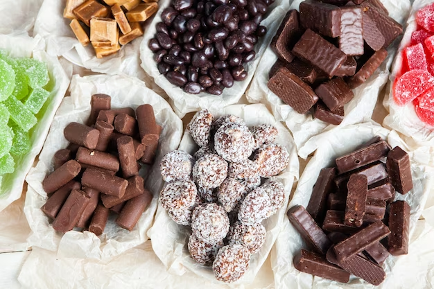 Assorted sweets neatly organized in separate trays for each type