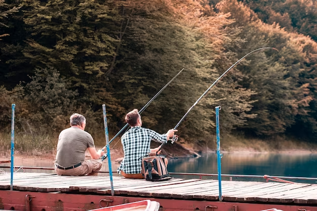 Two Men Fishing on a Lakeside Boardwalk