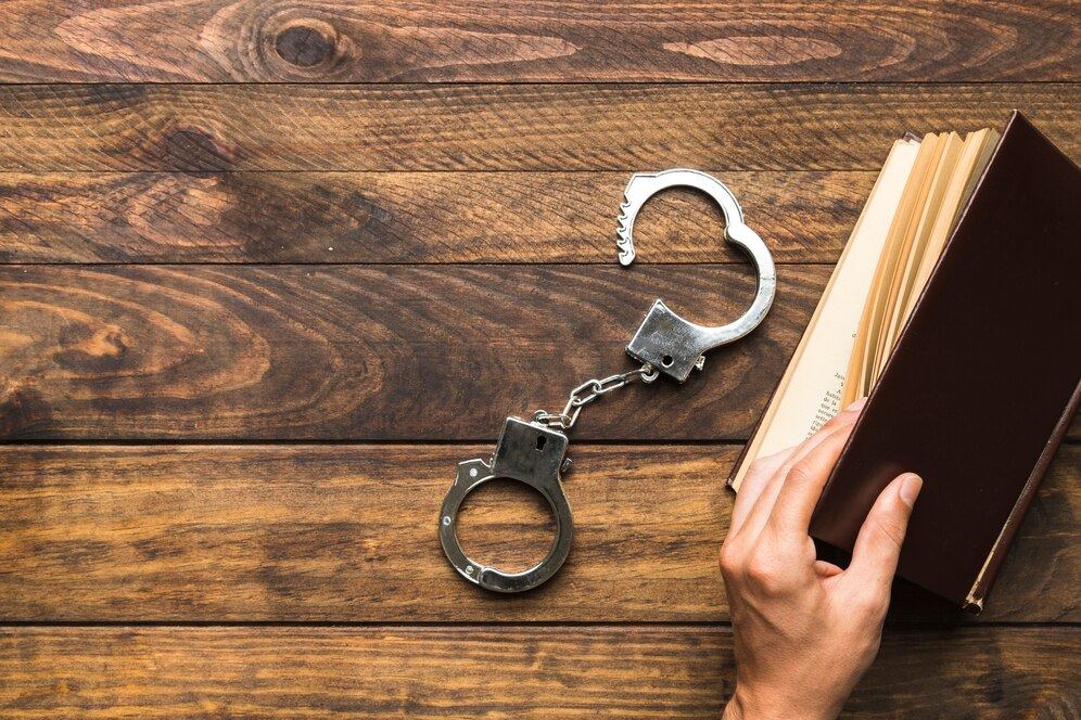 book and handcuffs
